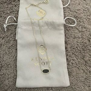 Kendra Scott gold druzy necklace with black sparkly center.